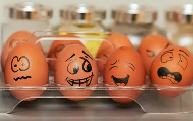 Eggs with various emotional expressions drawn on them, illustrating the emotional awareness skills that technical leaders must develop to manage teams effectively