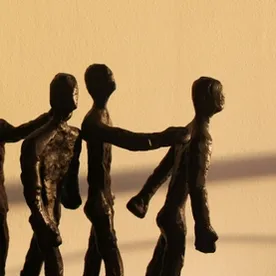 Five weathered figures connected in solidarity, representing resilient inclusion that strengthens through connection