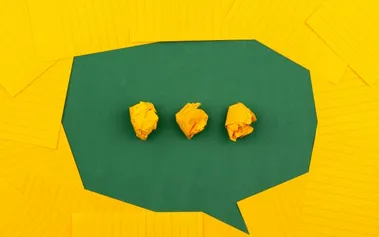 Crumpled paper in speech bubble representing AI-generated communication losing human authenticity