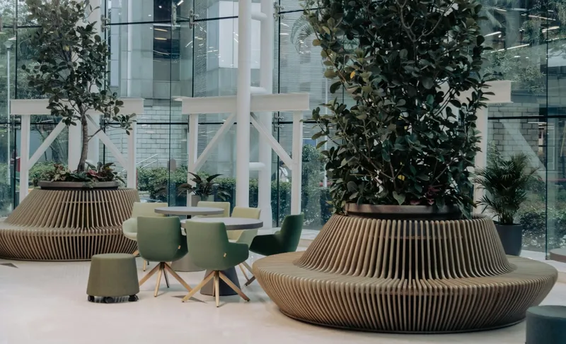 Contemporary business meeting space with natural elements, symbolising the integration of sustainability strategy into modern corporate decision-making