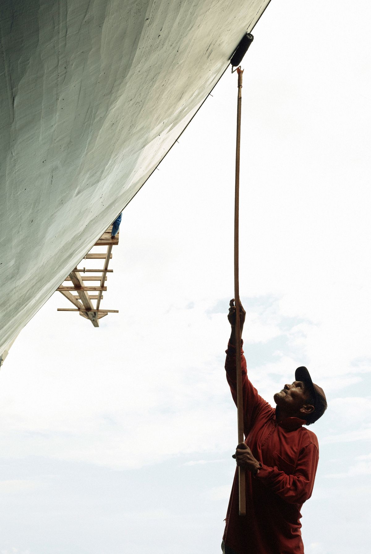 Guy using a paint roller