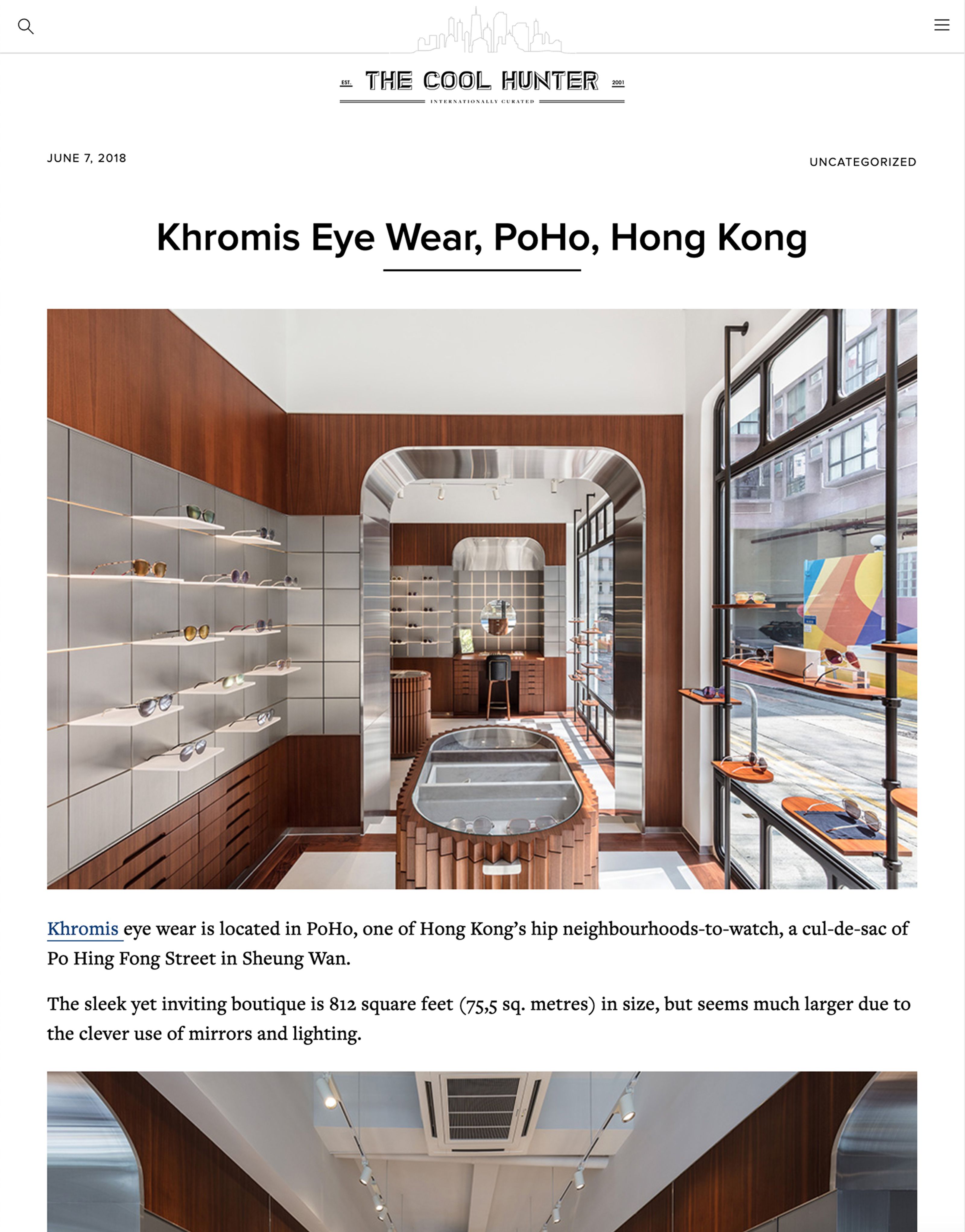 Interior of a sleek eyewear store with wood paneling, silver accents, and multiple eyeglasses on display.