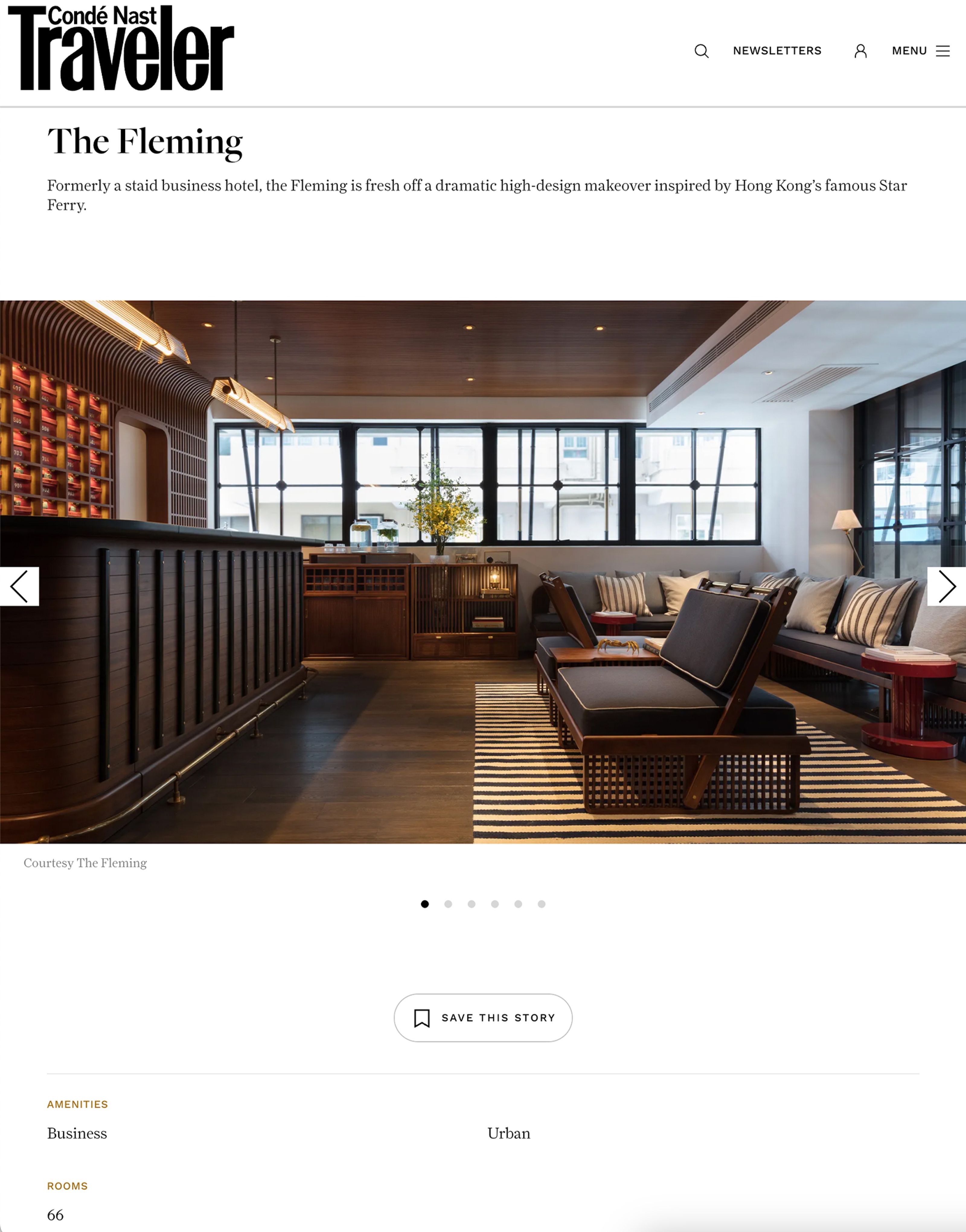 A stylish hotel lounge with a dark wood reception desk, striped seating, and large windows.