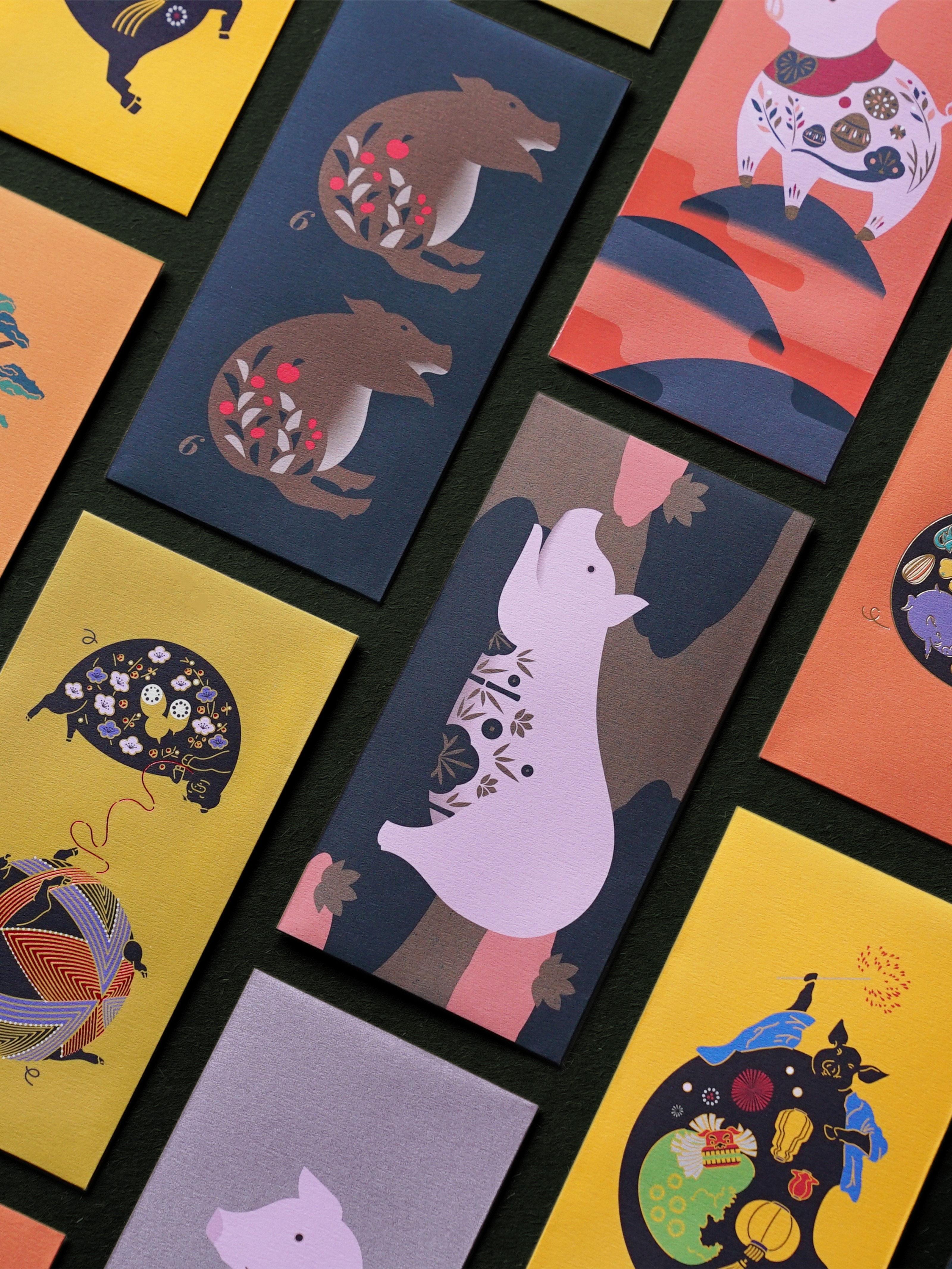 A collection of colorful decorative envelopes, many featuring illustrations of stylized pigs and nature.