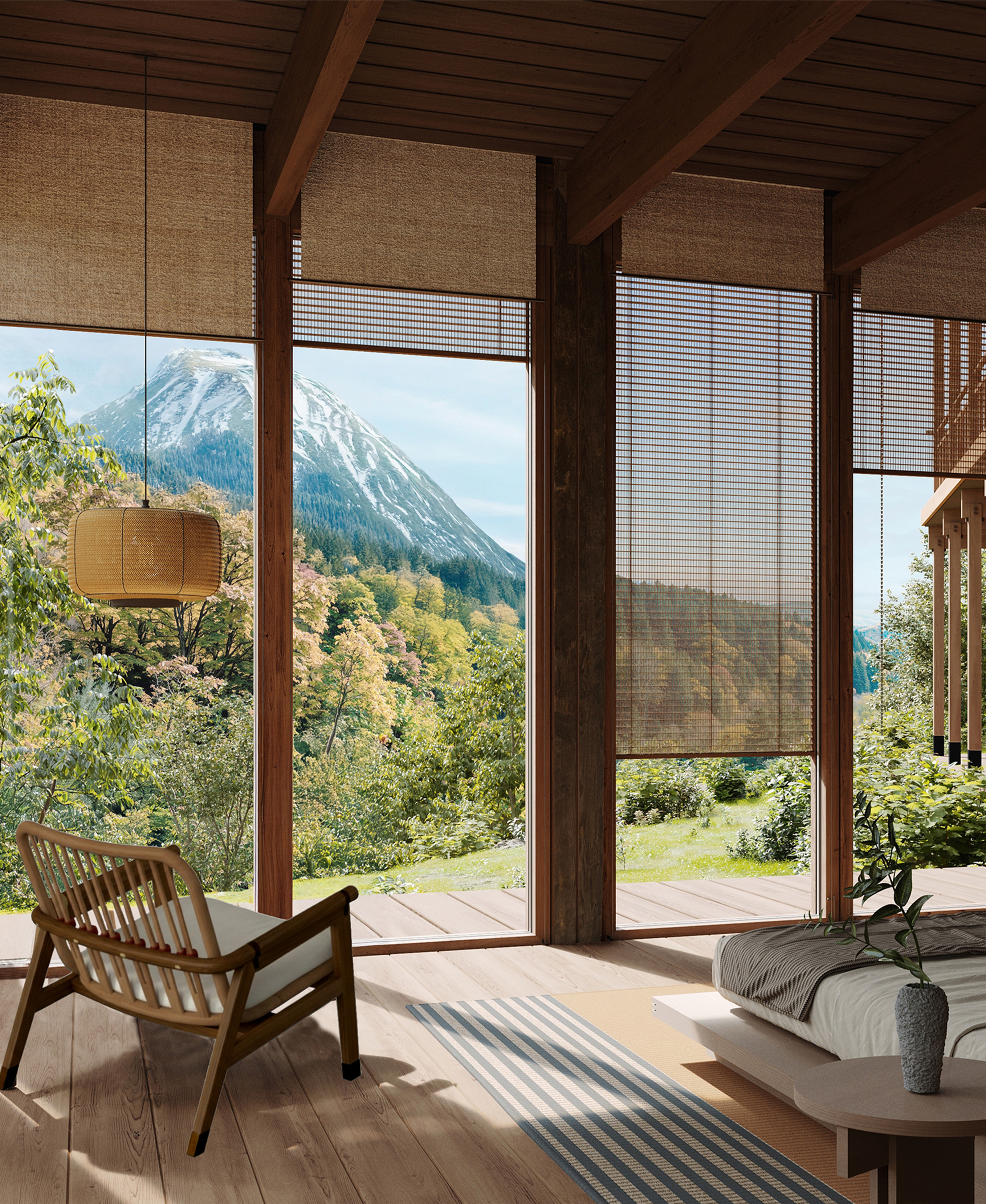Modern wooden interior with full-height windows offering a view of an autumn forest, featuring a dining table and a minimalist fireplace.