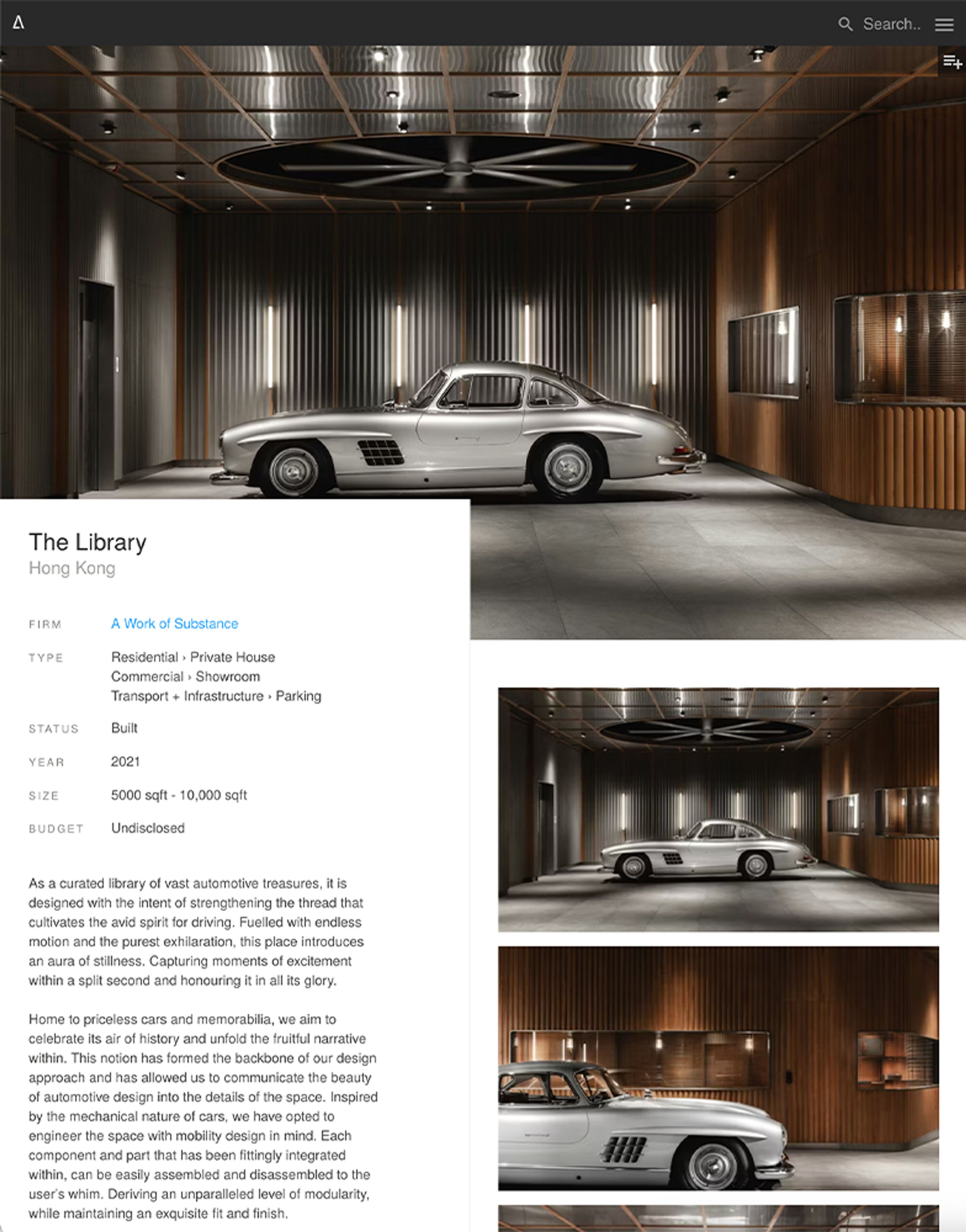 A silver classic Mercedes-Benz 300 SL Gullwing in a modern, luxurious garage.