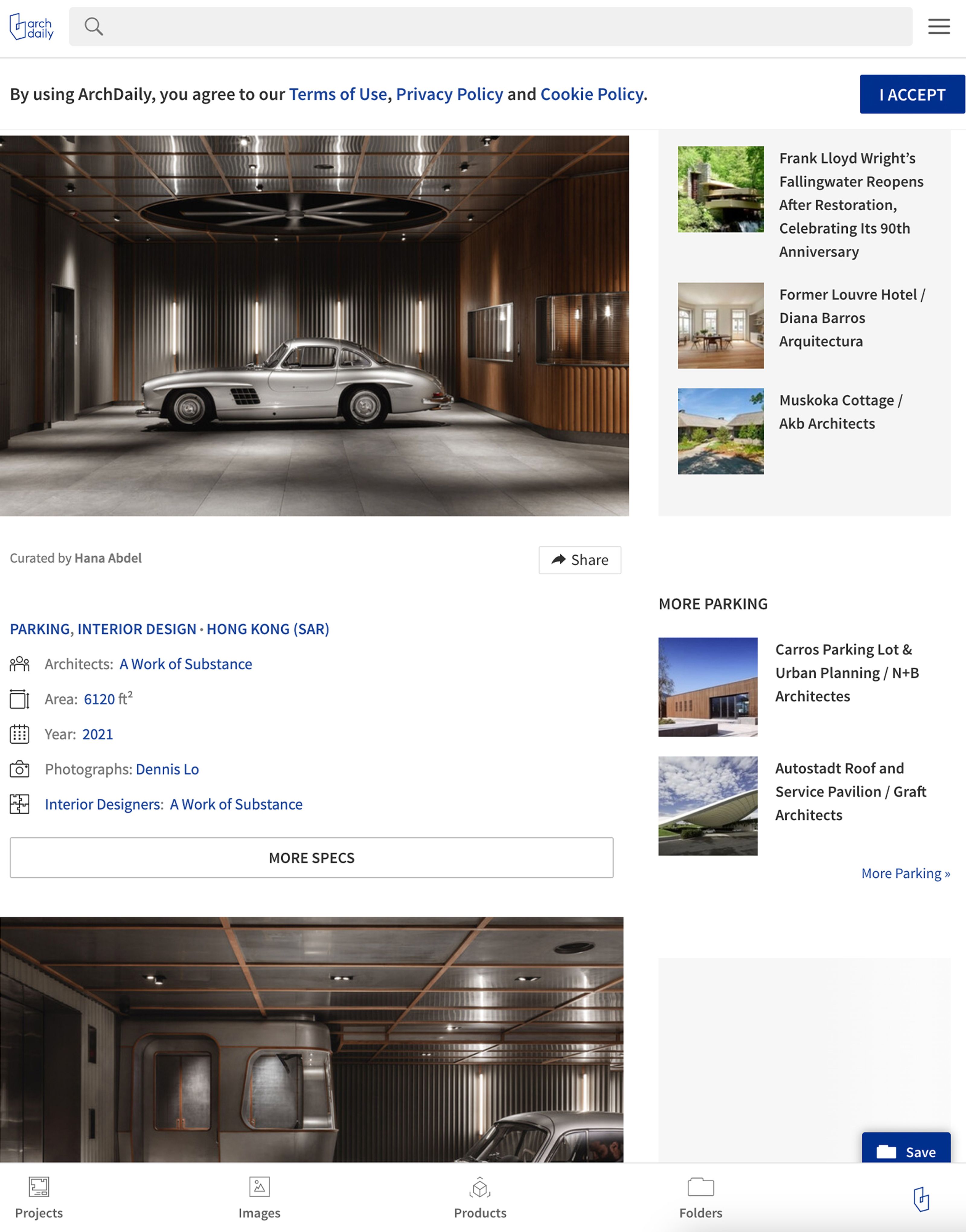 Silver Mercedes-Benz 300 SL Gullwing car parked in a modern, luxurious garage with wood-paneled walls.