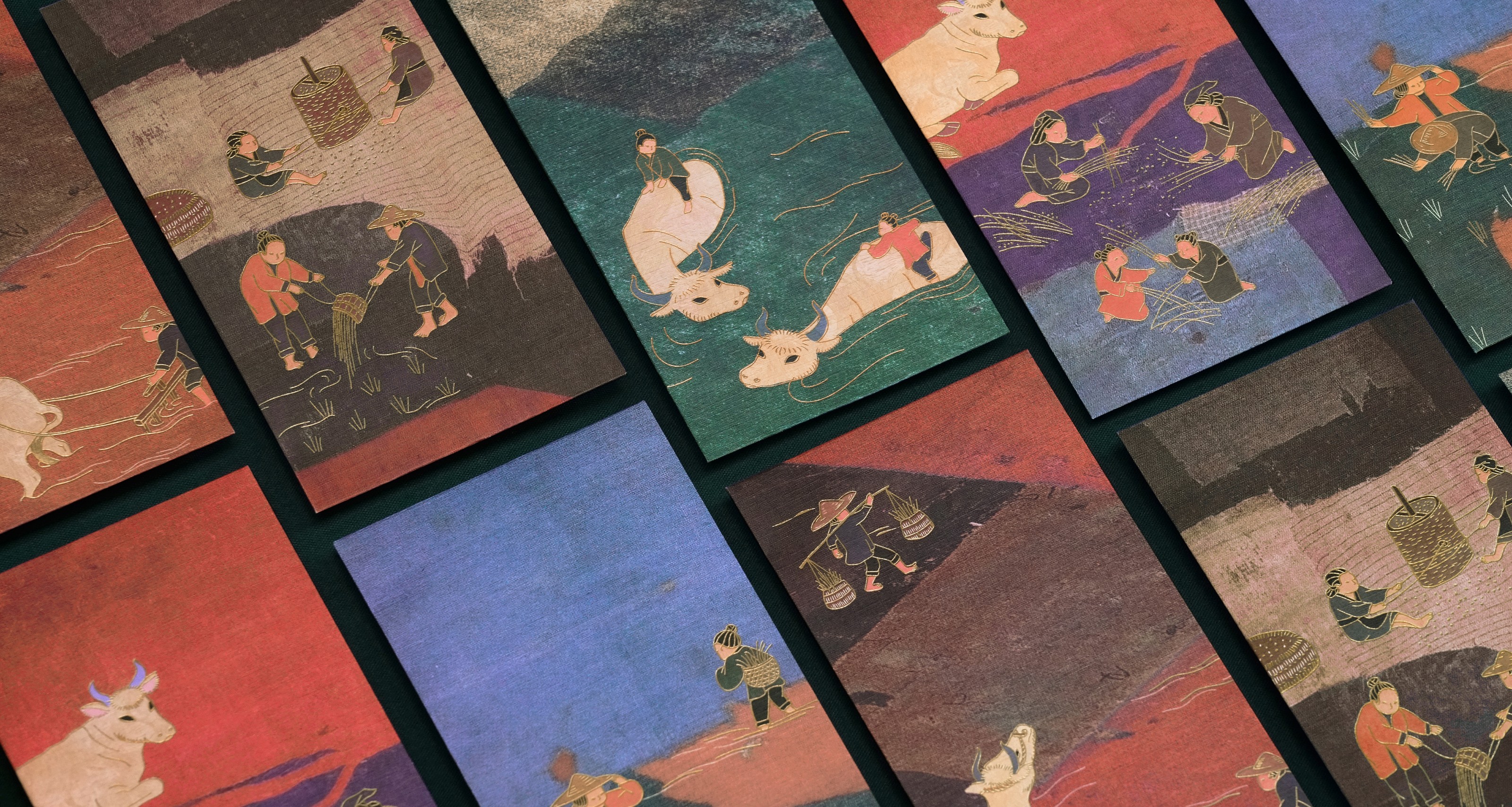 Traditional Asian art prints depicting rural scenes with people and oxen.