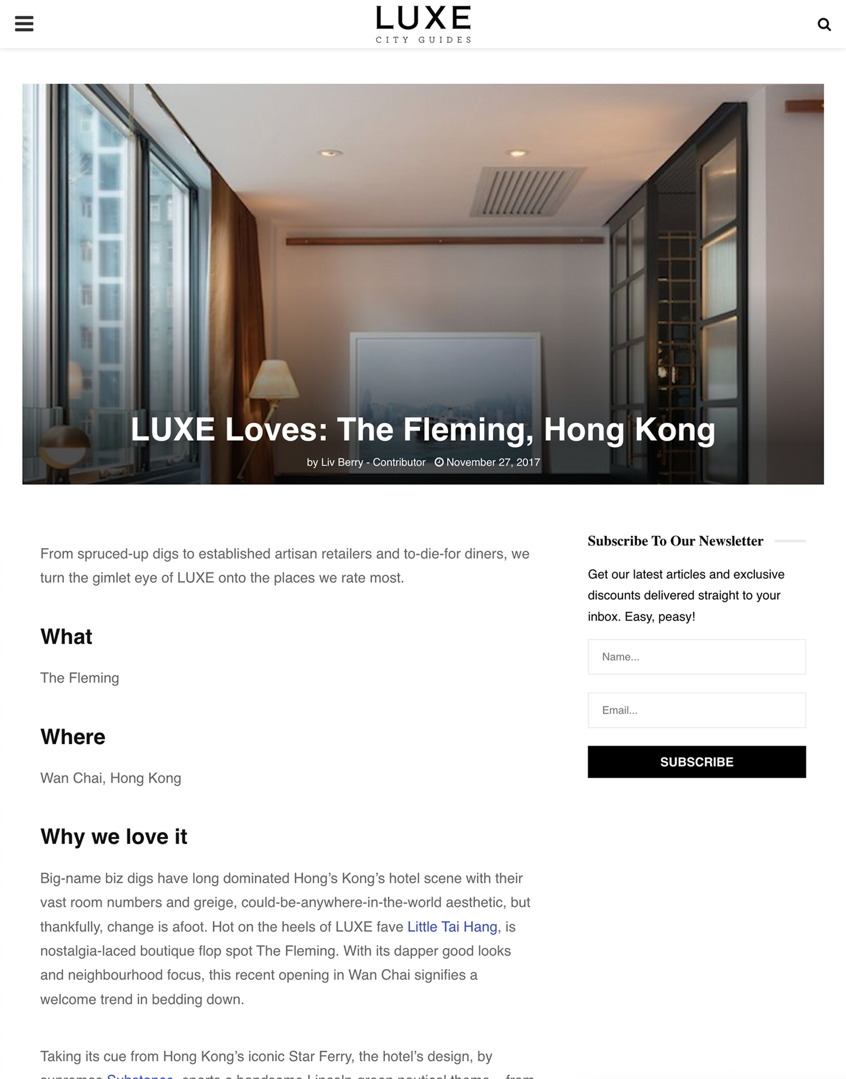 Modern hotel room interior with a large window, overlaid with the text 'LUXE Loves: The Fleming, Hong Kong'.