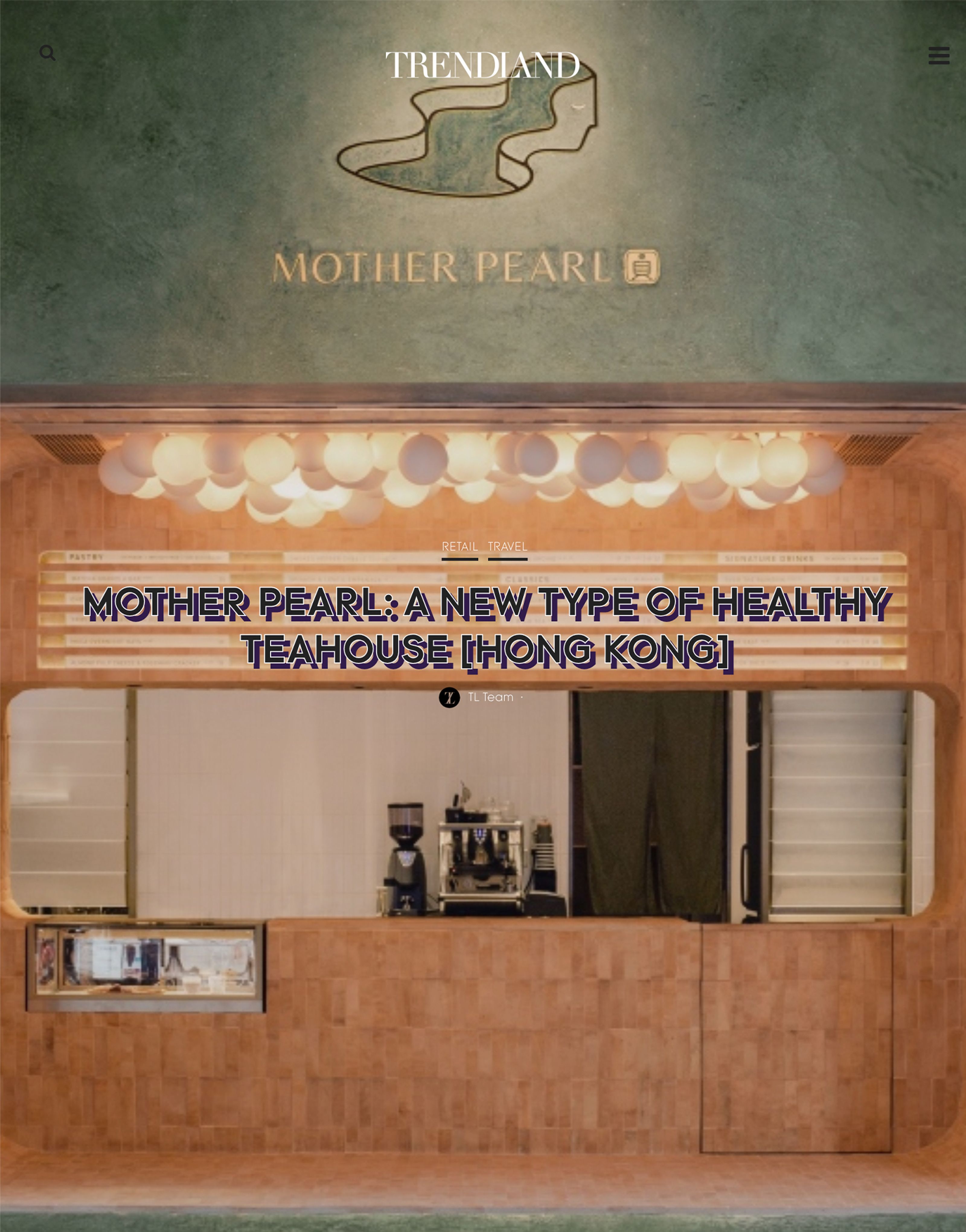 Mother Pearl, a healthy teahouse in Hong Kong, featuring a green logo wall, light wood counter, and spherical ceiling lights.