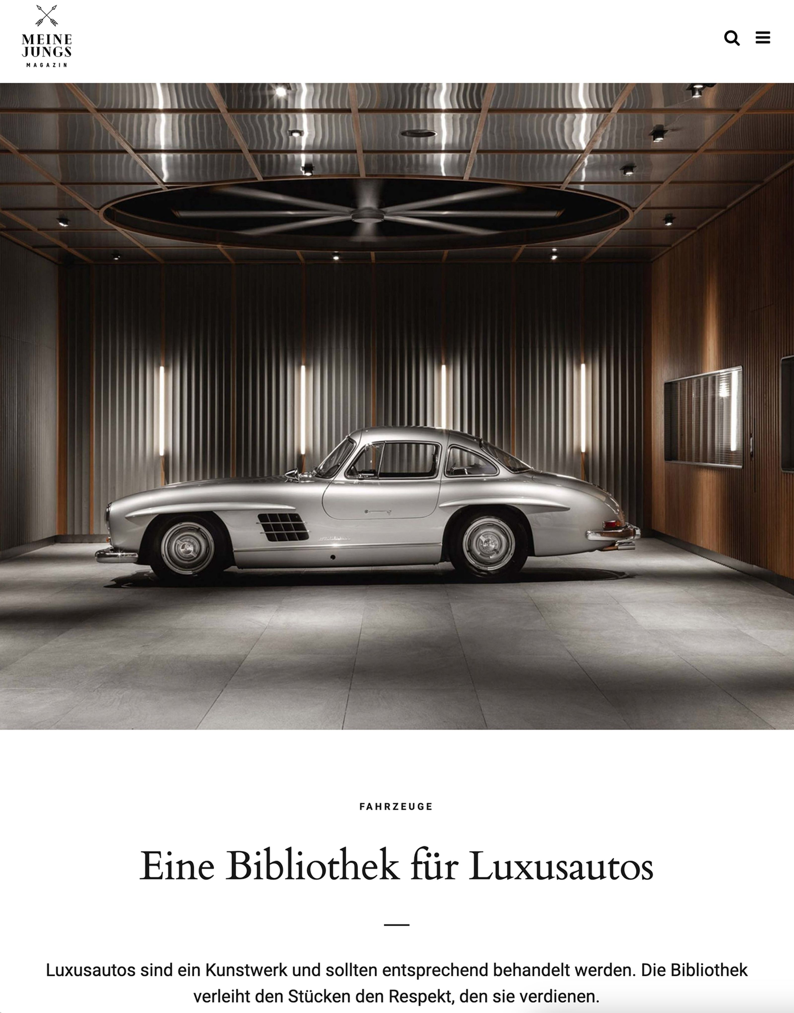 A silver Mercedes-Benz 300 SL Gullwing classic car parked in a modern, illuminated garage.