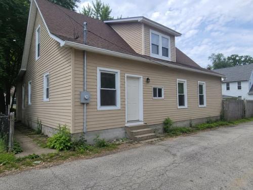 An older two-story Kansas City home, lived in and a little behind on maintenance