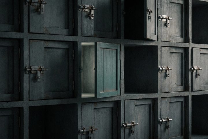 Abstract dark grid of locked and unlocked compartments suggesting database row access control