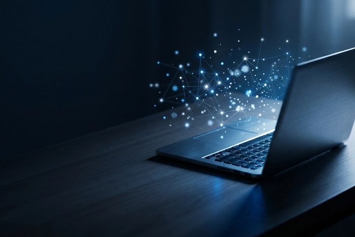 Dark desk scene with a laptop and an abstract blue agent interface, used as the GPT-6 Astra article cover