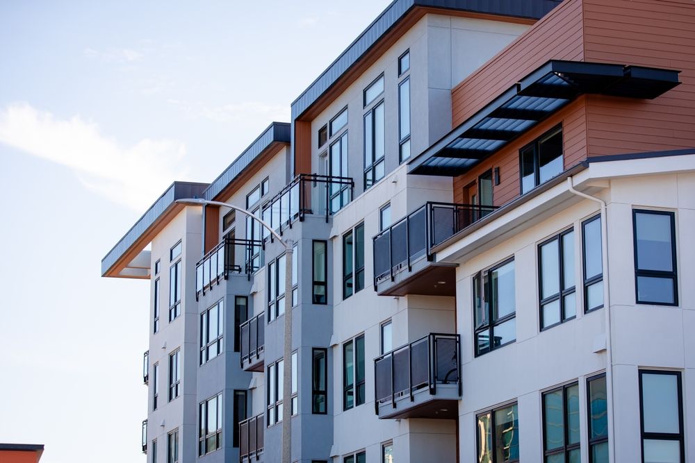 Exterior of a modern apartment complex with balconies, representing apartment security and negligent security claims after an attack.