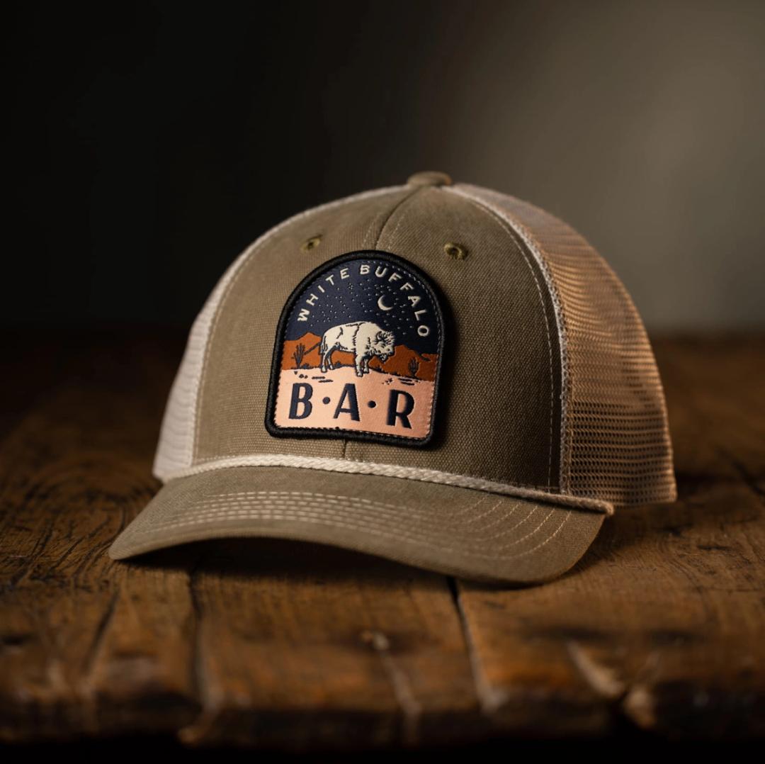 Hat with branded patch for White Buffalo Bar