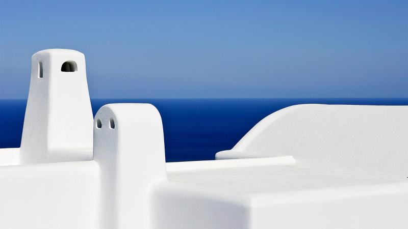 Stilen til Carpe Diem Santorini er 100% gresk med hvite og runde overflater