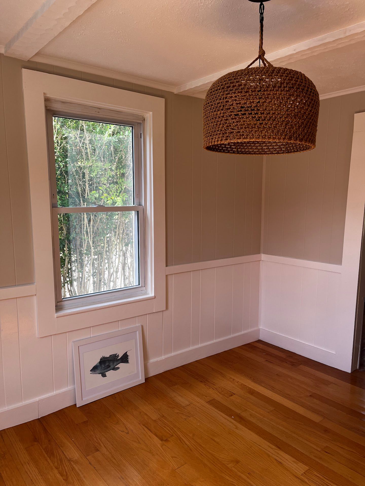Nelson Painting is a family-owned painting business that provides interior painting, shown here after a walls wainscoting trim project