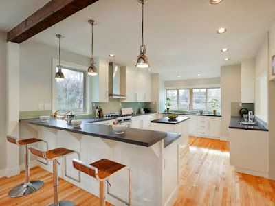 Nelson Painting is a local house-painting business that provides interior painting, shown here after a kitchen white walls exposed beam project
