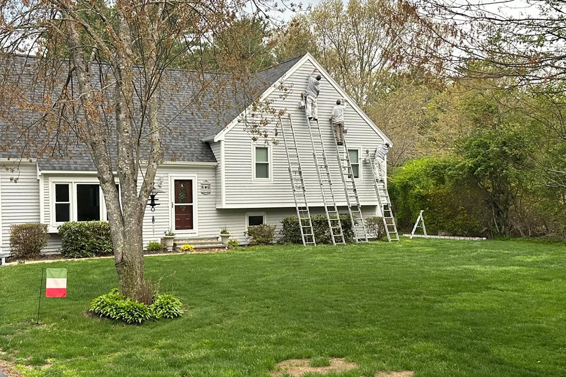 Exterior of a well-maintained New England home with fresh paint finish