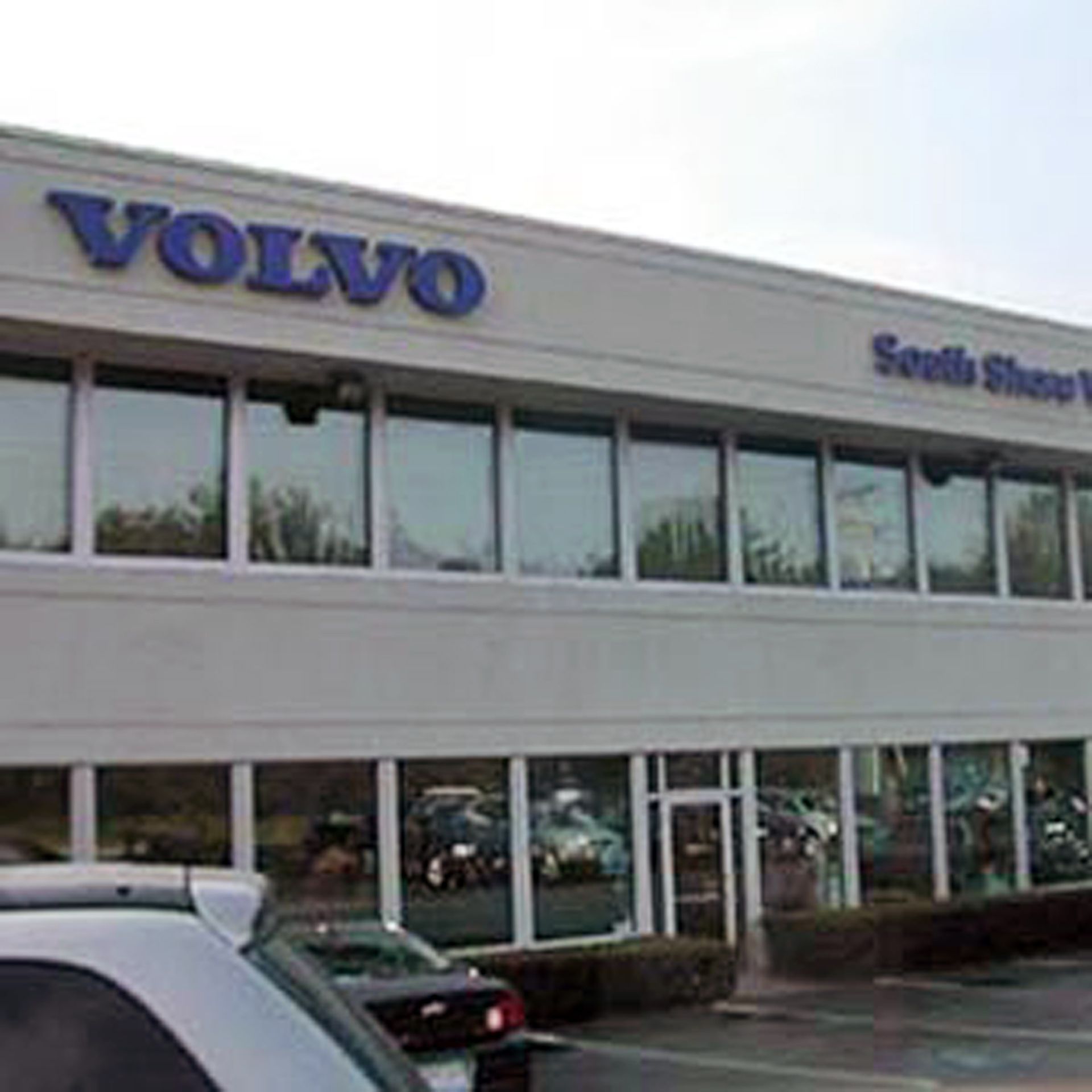 Nelson Painting is a local house-painting business that provides exterior house painting, shown here after a volvo dealership south shore project