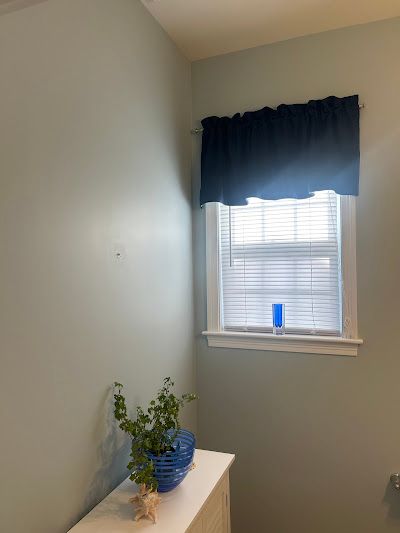 Nelson Painting is a family-owned painting business that provides interior painting, shown here after a laundry room light gray walls project