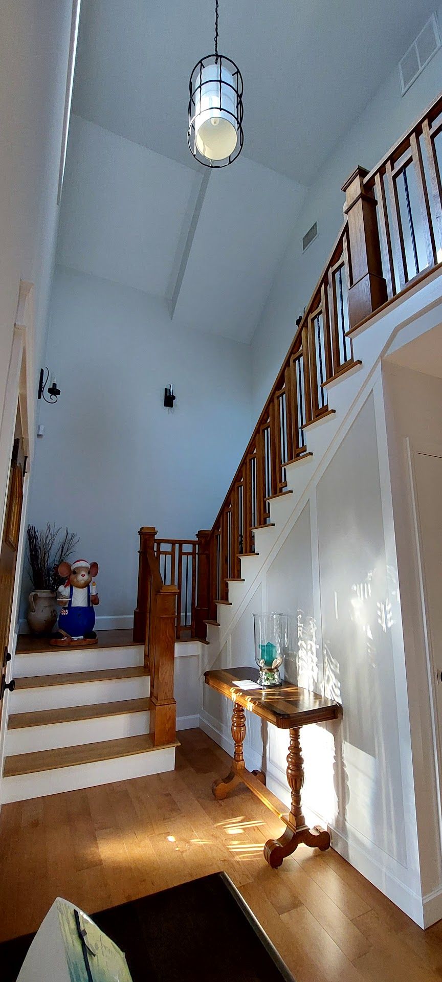 Nelson Painting is a painting contractor that provides interior painting, shown here after a foyer staircase vaulted ceiling project