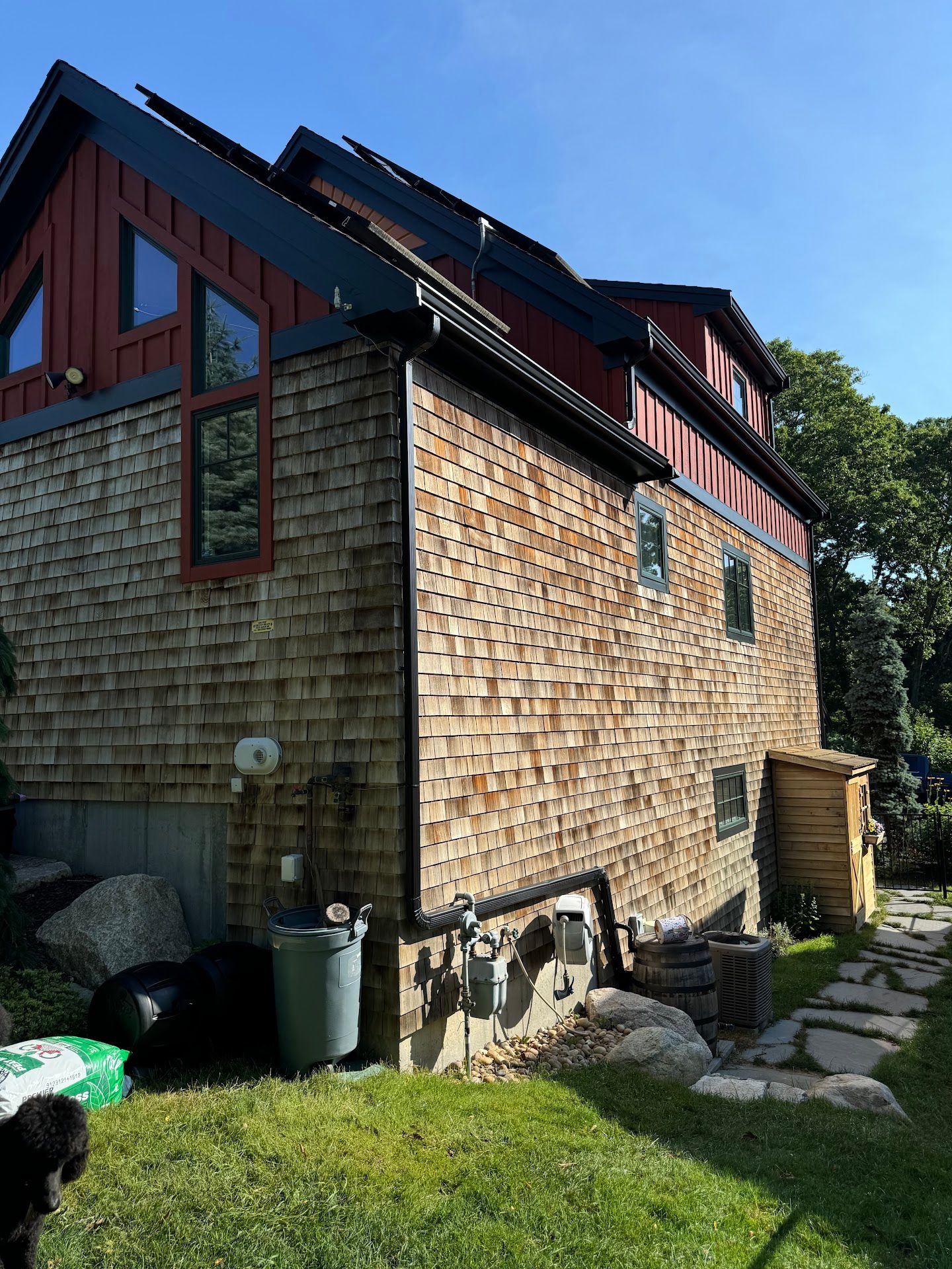 Nelson Painting is a painting company that provides carpentry services and exterior wood repair, shown before a cedar shingles weathered project