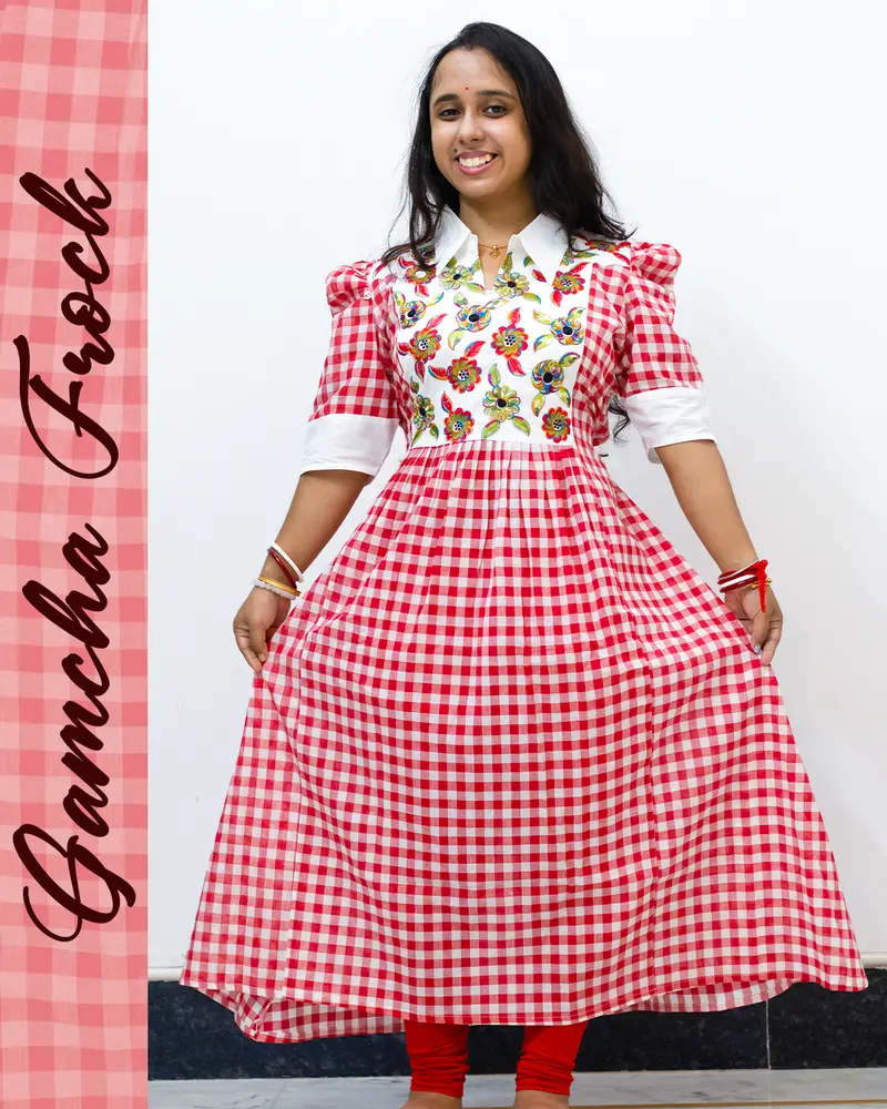 Gamcha frock with floral embroidery and puffed sleeves