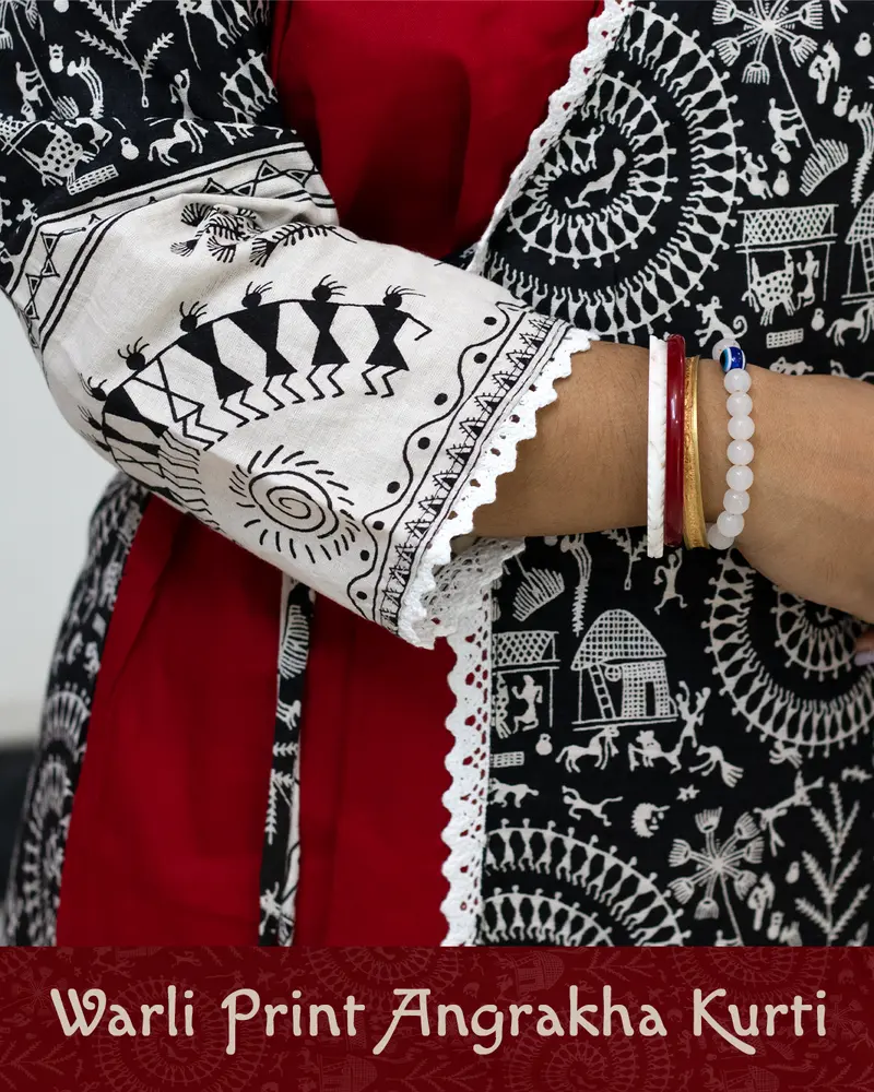 Woman wearing Warli Print Angrakha Kurti with lace detailing and side pockets