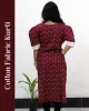 Woman wearing cotton kurti with Malayalam character print, puff sleeves, side pocket, thread work, and hand-painted yoke design – SutiSaaj.