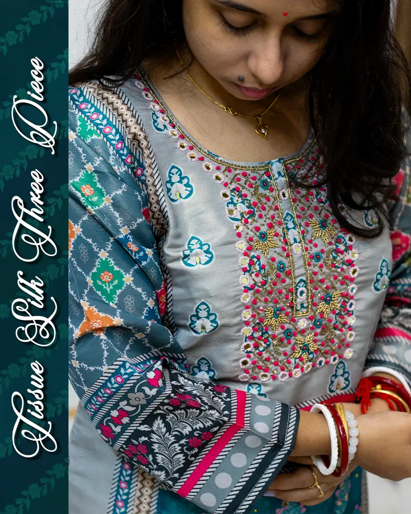Model wearing Tissue Silk Three Piece Set with mirror work and dupatta