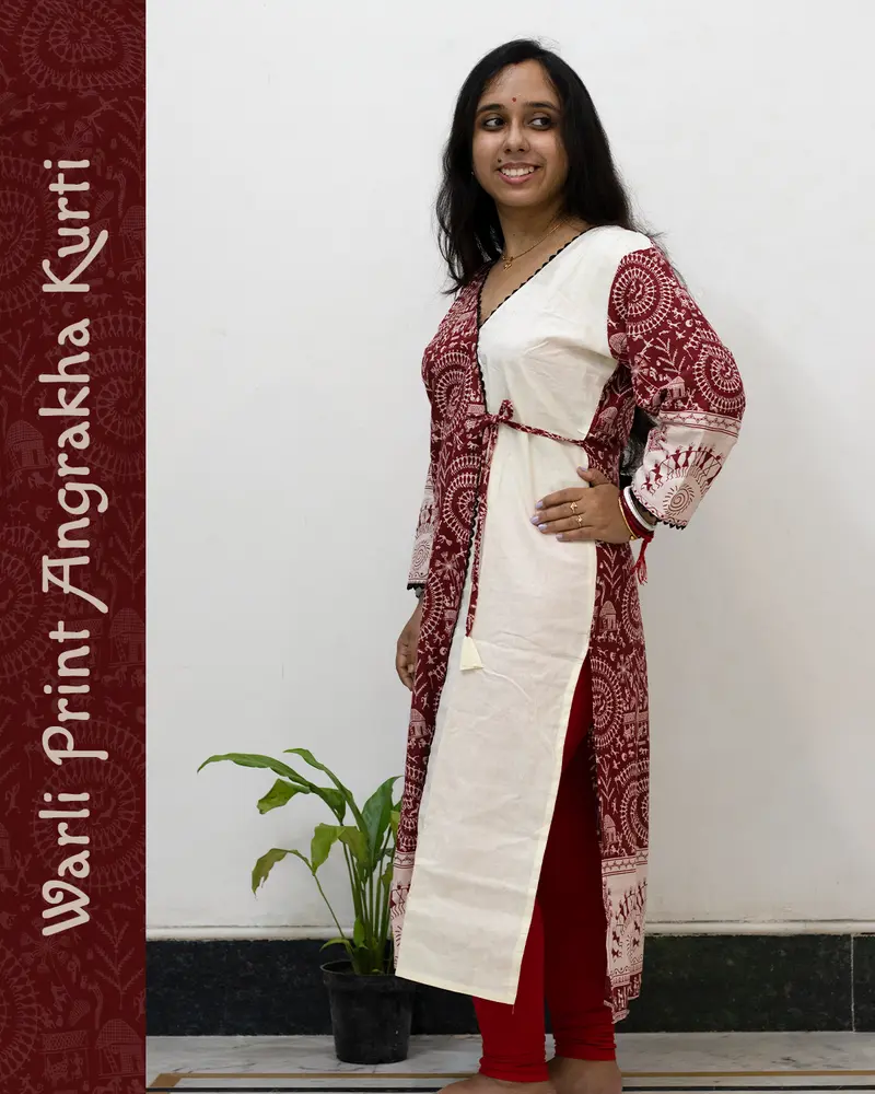Woman wearing Warli Print Angrakha Kurti with lace detailing and side pockets