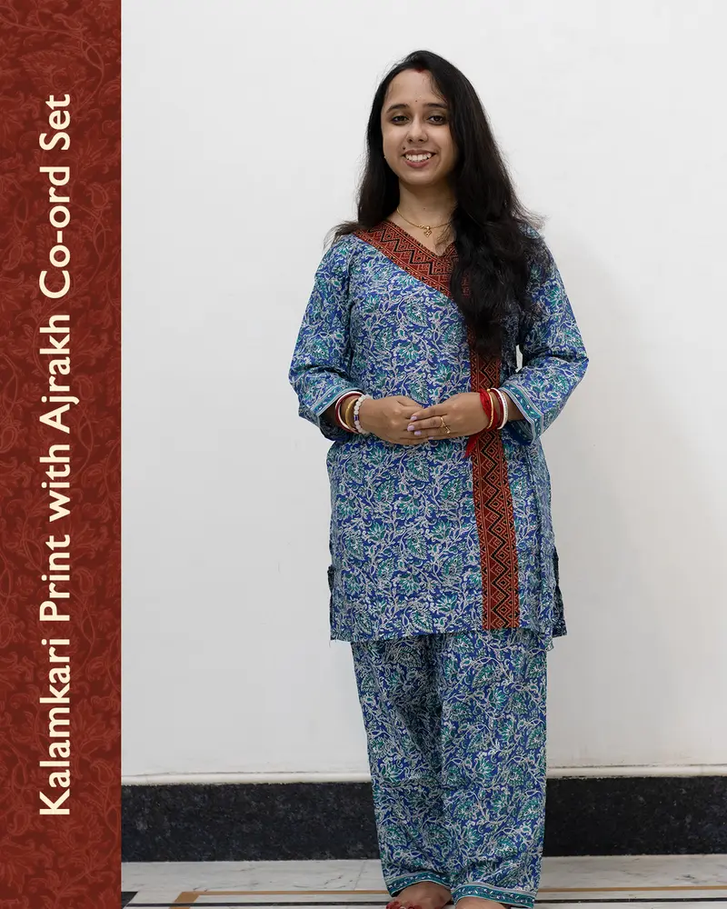 Woman wearing pure cotton Kalamkari print co-ord set with Ajrakh work and Angrakha pattern from SutiSaaj.