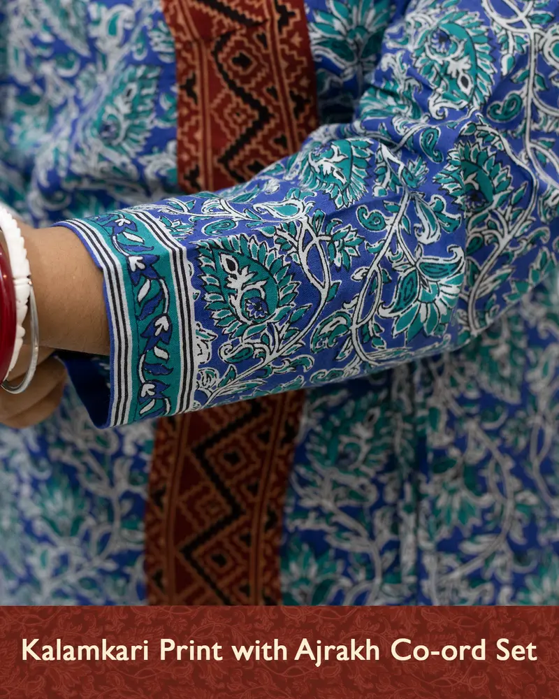 Woman wearing pure cotton Kalamkari print co-ord set with Ajrakh work and Angrakha pattern from SutiSaaj.