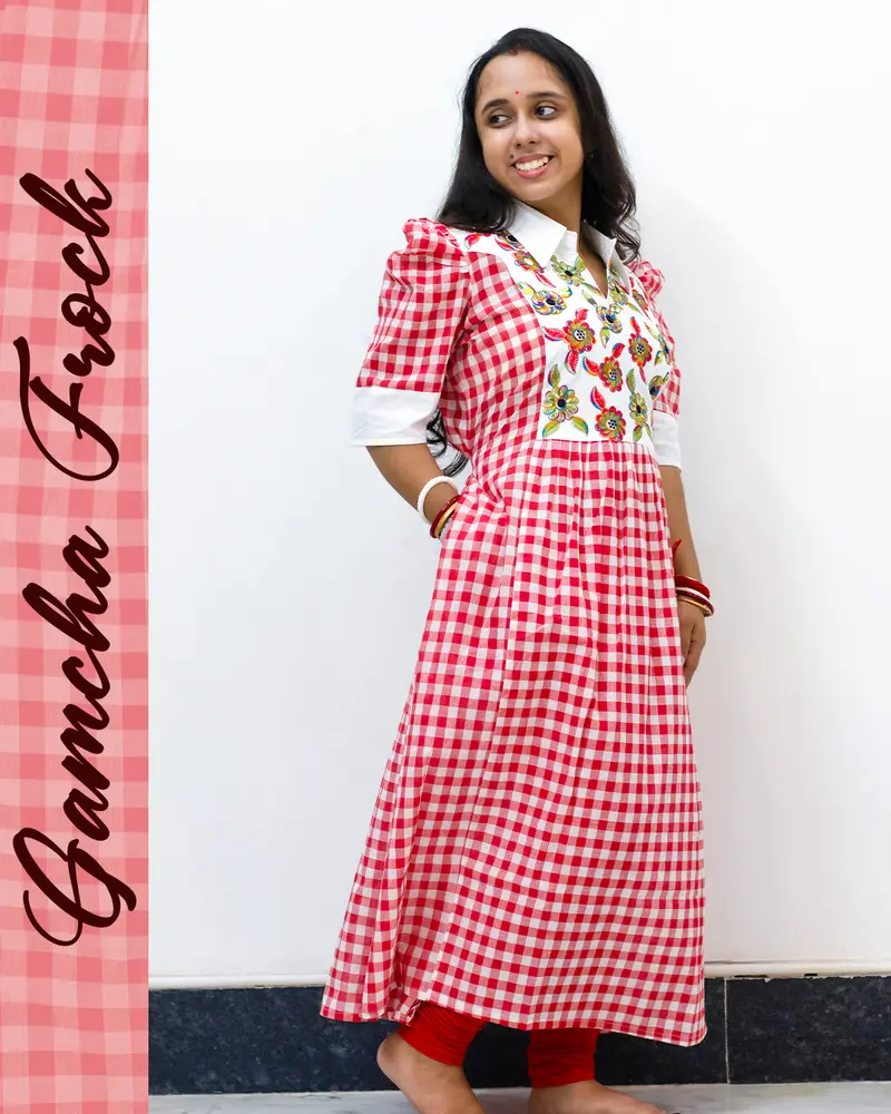 Gamcha frock with floral embroidery and puffed sleeves