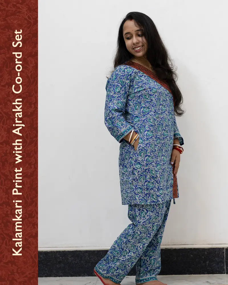 Woman wearing pure cotton Kalamkari print co-ord set with Ajrakh work and Angrakha pattern from SutiSaaj.