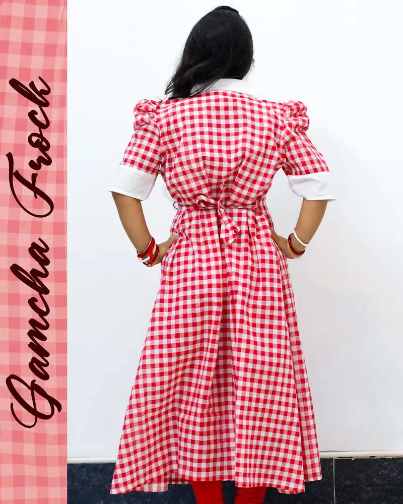 Gamcha frock with floral embroidery and puffed sleeves