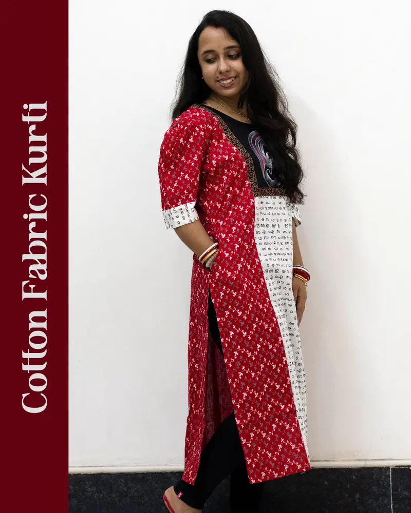 Woman wearing cotton kurti with Malayalam character print, puff sleeves, side pocket, thread work, and hand-painted yoke design – SutiSaaj.