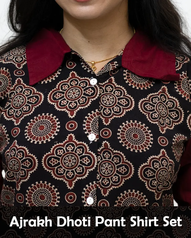 Woman wearing Ajrakh Dhoti Pant Shirt Set with printed shirt and black dhoti pants