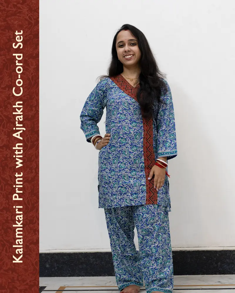 Woman wearing pure cotton Kalamkari print co-ord set with Ajrakh work and Angrakha pattern from SutiSaaj.