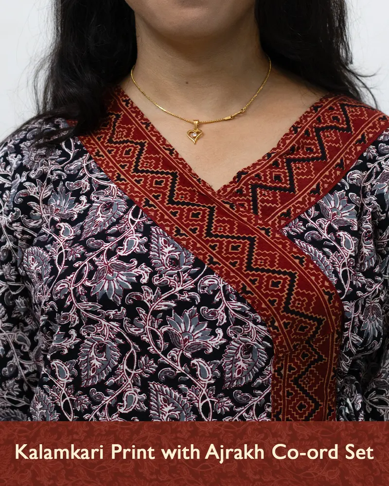 Woman wearing pure cotton Kalamkari print co-ord set with Ajrakh work and Angrakha pattern from SutiSaaj.