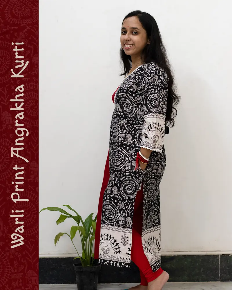 Woman wearing Warli Print Angrakha Kurti with lace detailing and side pockets