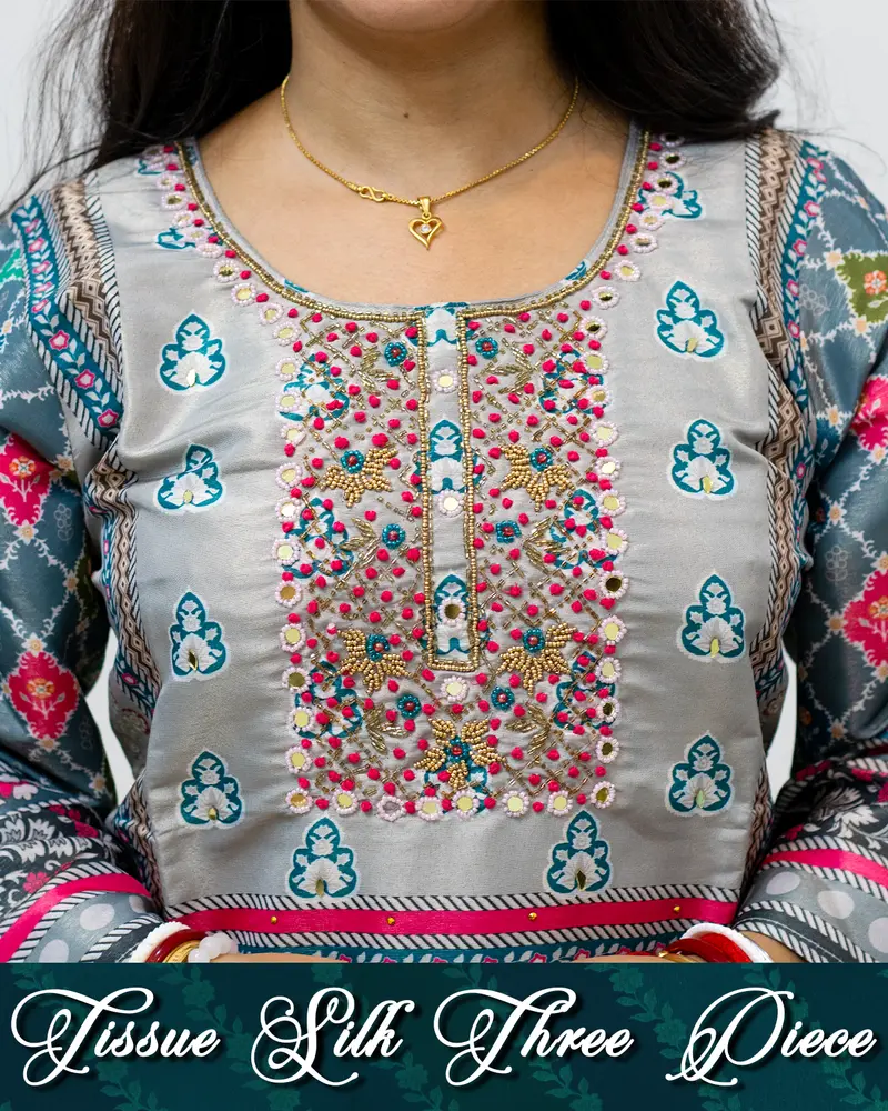 Model wearing Tissue Silk Three Piece Set with mirror work and dupatta