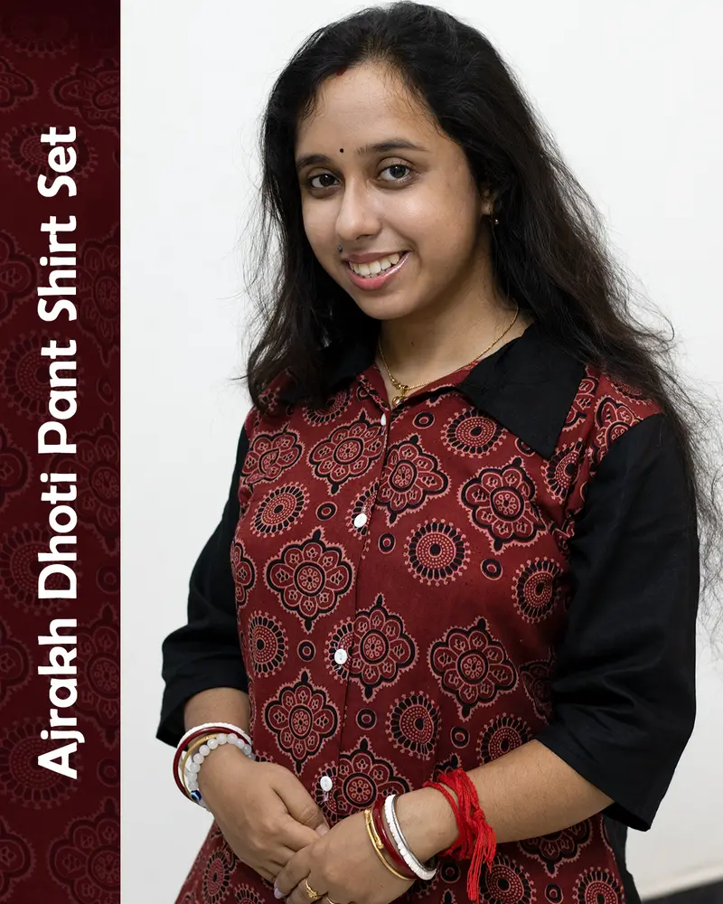Woman wearing Ajrakh Dhoti Pant Shirt Set with printed shirt and black dhoti pants