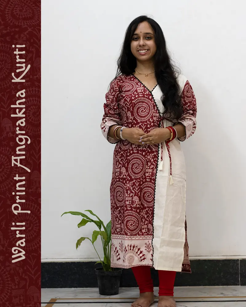 Woman wearing Warli Print Angrakha Kurti with lace detailing and side pockets