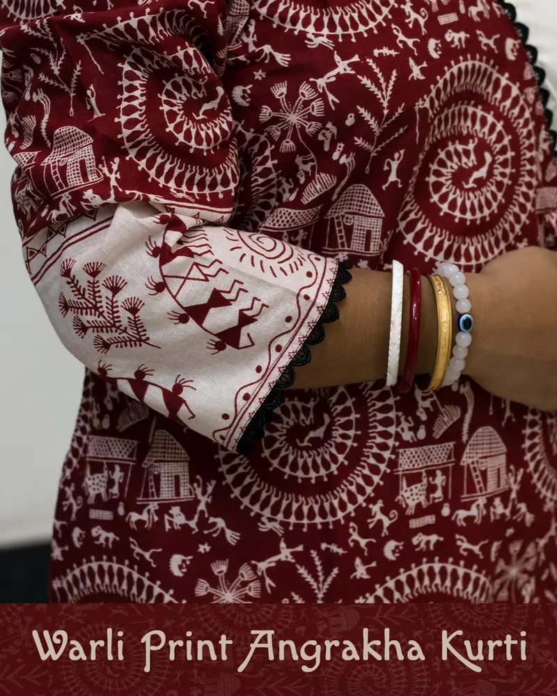 Woman wearing Warli Print Angrakha Kurti with lace detailing and side pockets