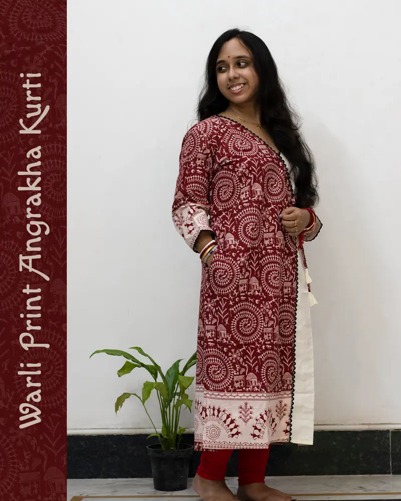 Woman wearing Warli Print Angrakha Kurti with lace detailing and side pockets