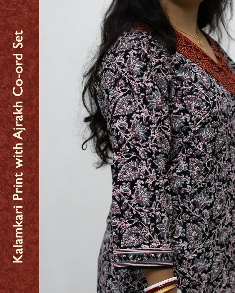 Woman wearing pure cotton Kalamkari print co-ord set with Ajrakh work and Angrakha pattern from SutiSaaj.
