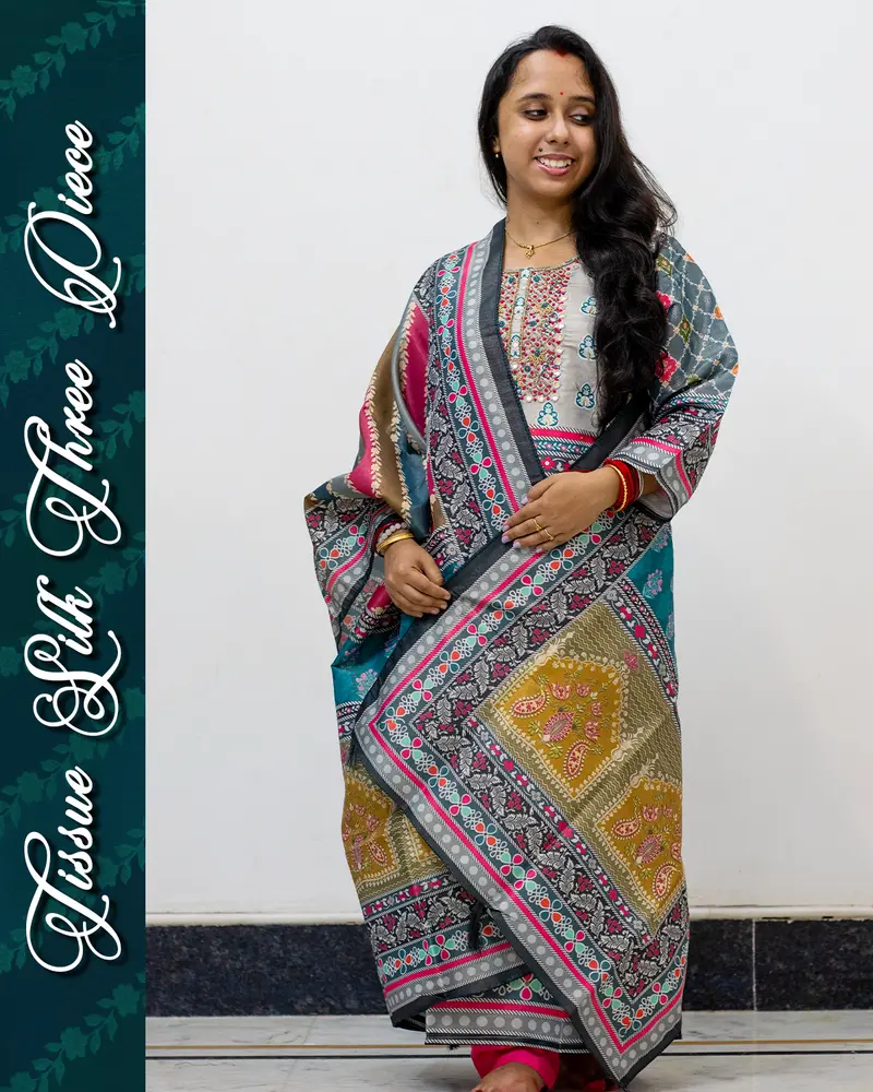 Model wearing Tissue Silk Three Piece Set with mirror work and dupatta
